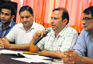 Anil Bedi, a trader, addresses  a press conference in Ludhiana.