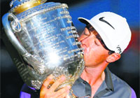 Rory McIlroy kisses the Wanamaker Trophy after winning the PGA Championship in Louisville, Kentucky, on Sunday.