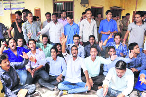UP IN ARMS: Students of DBS College stage a demonstration against the new admission norms in Dehradun on Monday