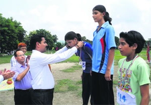 District Magistrate D Senthyl Pendiyan honours the winners of various events in Haridwar on Monday. 