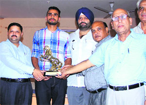 Arpinder Singh being honoured during a function at his college in Bathinda on Tuesday.