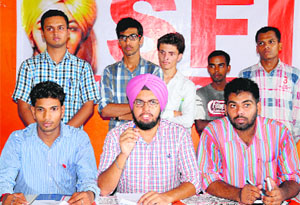 SFI workers address a press conference at the Student Centre in Panjab University on Tuesday.
