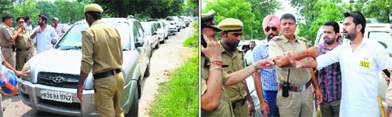 Party activists argue with policemen; and vehicles stopped by the police during a rally on the Panjab University campus in Chandigarh on Tuesday.