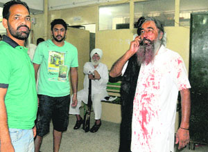 Kumbhra resident Sukhminder Singh (right ), who sustained injuries in a group clash on the Mohali District Administrative Complex on Tuesday.