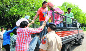 The police detain outsiders during a SOPU rally on the PU campus in Chandigarh on Tuesday