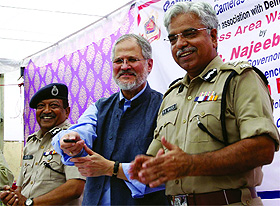 Lt Governor Najeeb Jung (C) with Delhi Police Commissioner B.S. Bassi (R) and Special Commissioner, Law & Justice, Deepak Mishra (L) during the inauguration of CCTV camera project under the Business Area Watch Scheme at Dariba Kalan in old Delhi on Tuesday.