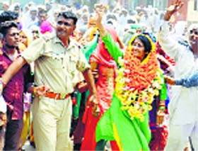 Congress leader Kamal Mann with her supporters in Assandh on Tuesday.