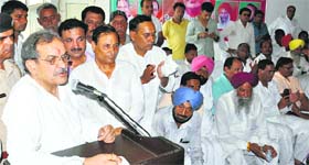 Congress leader Birender Singh makes a point at a workers meeting in Karnal on Tuesday.