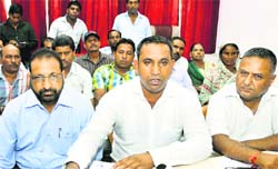 President of the Civic Safaikaramchari Union Rinku Gill addresses mediapersons in Jammu on Tuesday. A Tribune photo