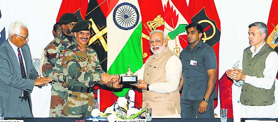 Army Chief General Dalbir Singh Suhag presents a memento to Prime Minister Narendra Modi as Governor NN Vohra and Chief Minister Omar Abdullah look on in Leh on Tuesday. A Tribune photograph