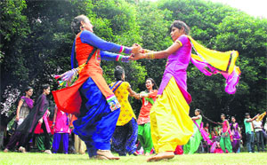 Students of Lyallpur Khalsa College for Women enjoy during a Teej celebration programme in Jalandhar on Tuesday. 