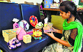 A home science student displays items made of waste material on the PAU campus in Ludhiana.