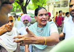 Mother of Independent candidate Balkar Sidhu argues with AAP workers in Talwandi Sabo on Tuesday.