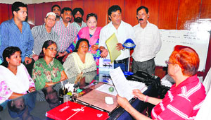 State Congress committee members meet PWD chief officer at his office in Dehradun on Tuesday.