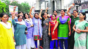 BJP womens wing activists protest against the Congress government at Chandracharya Chowk in Haridwar on Tuesday.