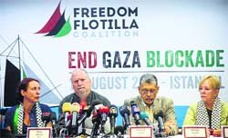 A member of the Freedom Flotilla Coalition Dror Feiler (2nd L) speaks during a press conference in Istanbul on Tuesday. AFP