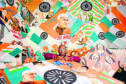 Kite-makerJagmohan Kanojia makes tri-coloured kites ahed of Independence Day in Amritsar on Wednesday