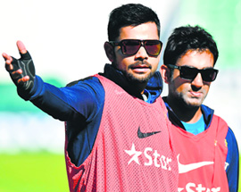 Virat Kohli (L) and Gautam Gambhir during a practice session at the Oval in London on Wednesday, ahead of the fifth Test between England and India that starts on August 15.