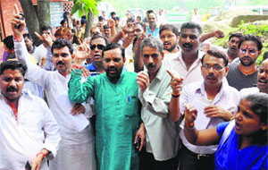 Members of the Rashtriya Valmiki Krantikari Morcha protest at the DSO office in Dehradun on Wednesday.