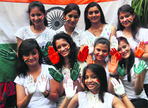 Girls of Sardar Bhagwan Singh Institute paint themselves in Tricolour in the run-up to Independence Day in Dehradun on Wednesday.