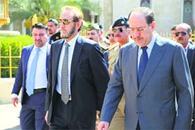 Iraqs PM Nuri al-Maliki (R) on way to attend the funeral of General Majid Abdul Salam in Baghdad on Wednesday