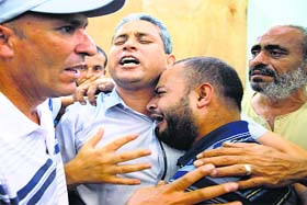 A Palestinian man mourns the death of his relative in Beit Lahiya in Gaza on Wednesday