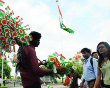 A vendor sells tricolour flags on the eve of Independence Day in New Delhi on Thursday.