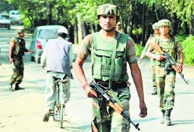 gearing up for I-Day: Army men keep vigil in Srinagar on Thursday.