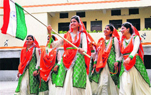 Girls dressed in hues of the Tricolour wait to perform at PCM SD College of Women during a talent hunt show in Jalandhar on Thursday.