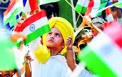 A boy dressed as Bhagat Singh celebrates Independence Day at Kiddies Paradise School in Ludhiana
