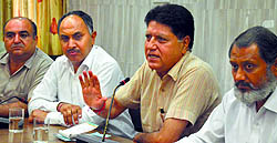 Prof Rajinder Bhandari, member SAD-BJP coordination committee, addresses a press conference in Ludhiana