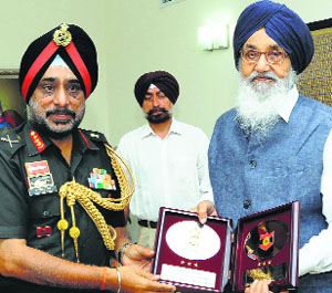 Lt Gen KJ Singh, General  Officer Commanding -in- Chief, Western Command, with Chief Minister Parkash Singh Badal at the latters residence in Chandigarh on Thursday.