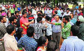 PUSU and NSUI activists argue at the Law Auditorium in Panjab University on Saturday. 