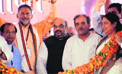 BJP president Amit Shah and Birender Singh in Jind on Saturday. Photo: Manoj Dhaka