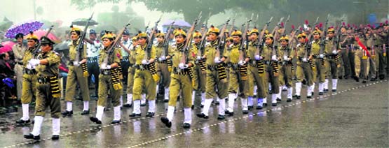 Police personnel march past during the 68th Independence Day celebrations on The Ridge in Shimla on Friday. Tribune photo: Amit Kanwar