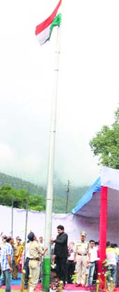 Urban Development Minister Sudhir Sharma unfurls the national flag on the Independence Day in Chamba on Friday.