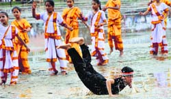 Schoolchildren perform a cultural dance during Independence Day celebrations at the 