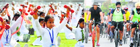 Students present a lazium show; and (right) cyclists take part in a rally in Ludhiana.