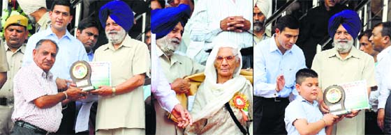 (From left) Punjab Vidhan Sabha Speaker Charanjit Singh Atwal honours Pardeep Dhall, a social activist; a freedom fighter; and nine-year-old Aryan Verma at Guru Nanak Stadium in Ludhiana.