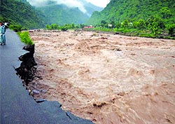 A road damaged by the raging Saung in the Tehri Garhwal area, near Dehradun, on Saturday