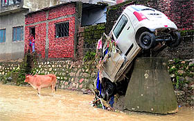 a car swept away by floods at New Cantt in Dehradun