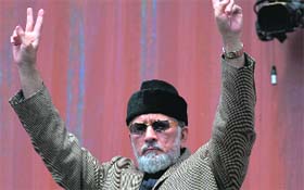 Canada-based preacher Tahir-ul-Qadri lead their respective protest rallies in Islamabad on Saturday