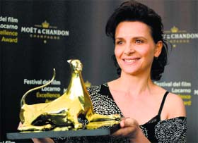 French actress Juliette Binoche poses during a photocall where she received the award Excellence Award at the 67th Locarno International Film Festival in Locarno, Switzerland.