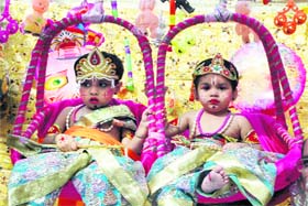 Celebrating Krishnas birth: Children dressed as Lord Krishna