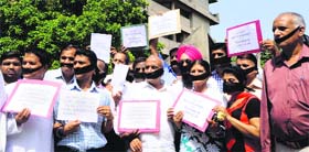 PU employees hold a protest against the PU authorities