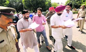 NSUI activists give a memorandum to Syndicate members of the university outside the meeting hall on Sunday