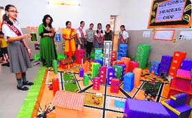 A student explains a model of Hexagonal Fractal City during the annual exhibition at Manav Mangal High School, Sector 21, Chandigarh.