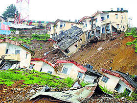 Houses that got damaged after a landslide at Tirah Lines in Dharamsala in 2013.