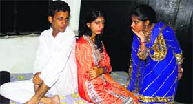 Artistes enact a scene from the play 'Aitvaar Di Sair' staged at Natrang Studio Theatre in Jammu on Sunday.