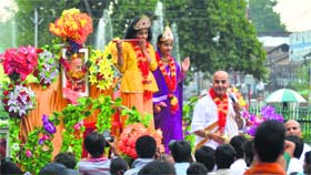 Children dressed as Lord Krishna and Radha take part in a religious procession in Srinagar on Saturday.